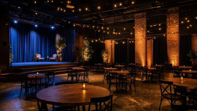 An event hall with string lights, brick columns and round tables, How to Start a Wedding or Event Venue in Wisconsin Under the 2026 Alcohol Rules